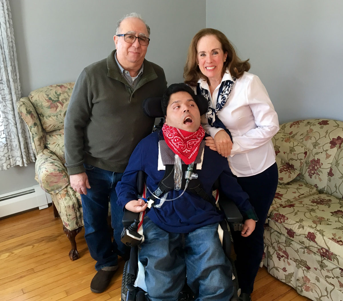Mother and Father with son who is confined to a wheelchair