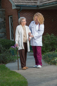 Pediatrician helping Senior lady