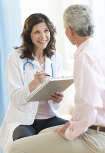 Pediatrician sitting with patient.