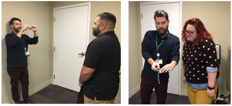 Rob enjoying one of his favorite job responsibilities – meeting new employees on their first day of orientation and taking their badge photos. (Photo on Left: Rob snaps a photo of Daniel (Case Management). Photo on Right: Rob checks with Kellie (Case Management) to make sure she is happy with her badge photo.)